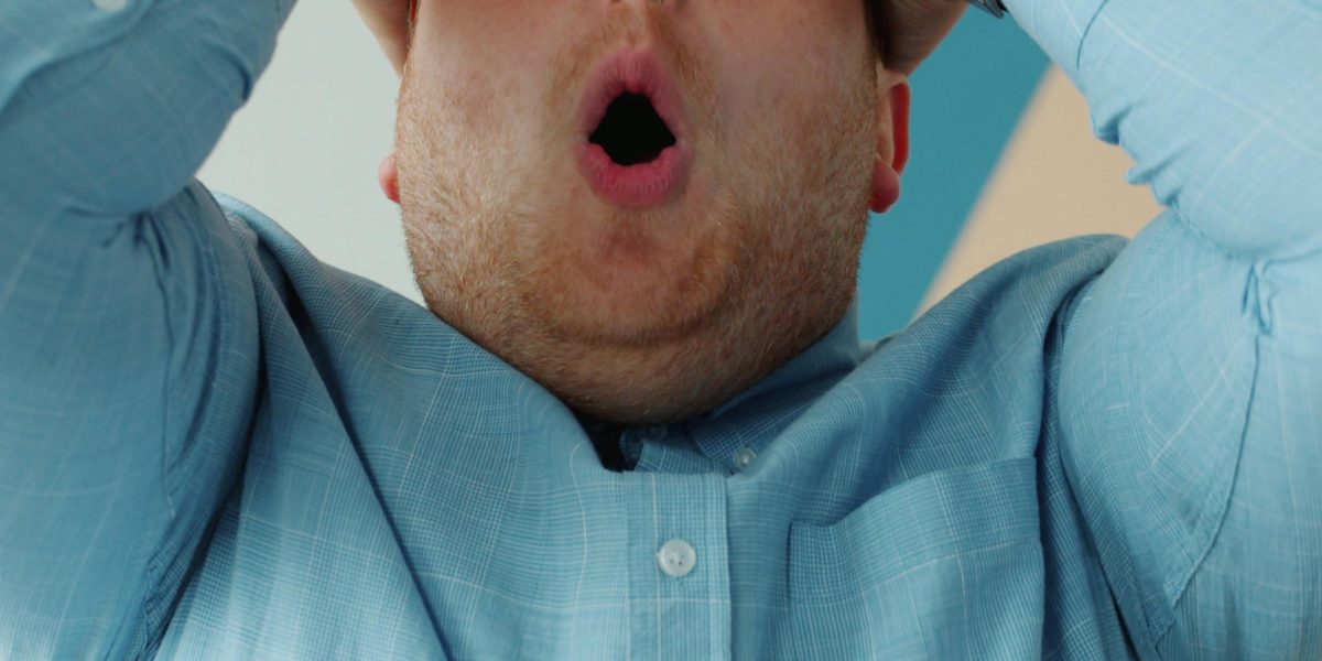 Capturing the moment of surprise when an audience member witnesses a comedian's dramatic turn.