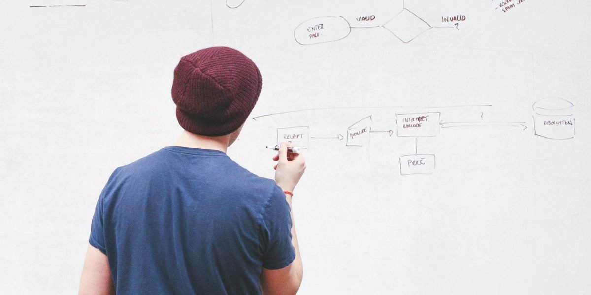 A creative individual actively brainstorming and developing funny concepts for stories.